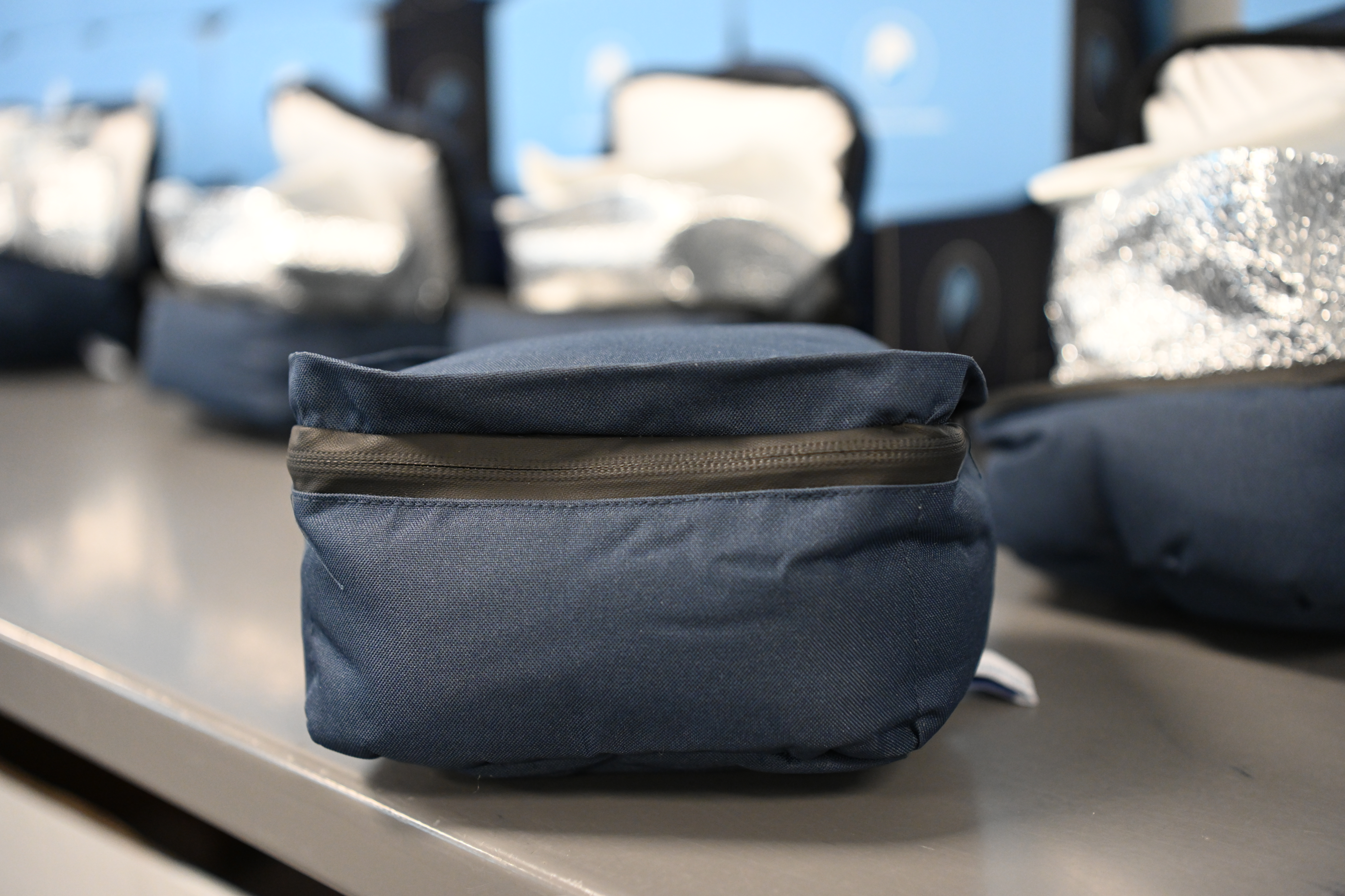 Closed cotton-based insulated package with zipper, designed for product shipping.